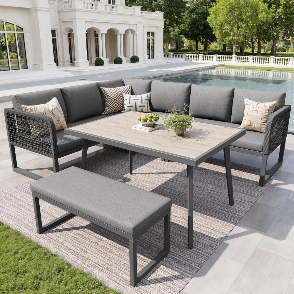 Conjunto de móveis de jardim modular cinzento com mesa e almofadas