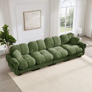 Sofá modular em chenille verde com costura acolchoada e almofada