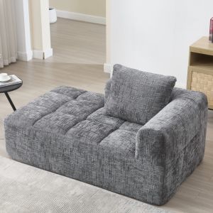 Sofá chaise longue em chenille cinzento com almofada e bolsos laterais